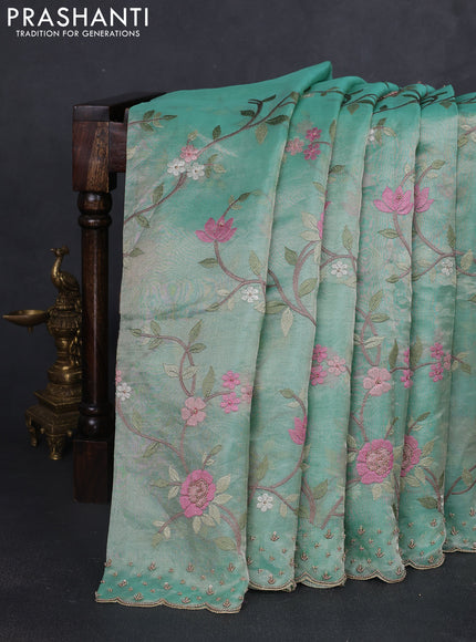 Tissue silk saree pastel green with allover embroidery work and beaded work border