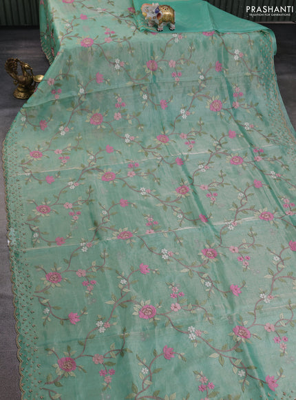Tissue silk saree pastel green with allover embroidery work and beaded work border