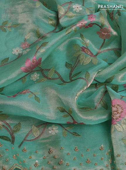 Tissue silk saree pastel green with allover embroidery work and beaded work border
