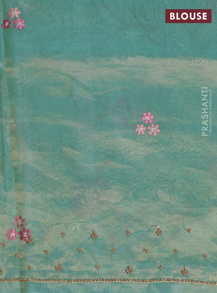 Tissue silk saree pastel green with allover embroidery work and beaded work border
