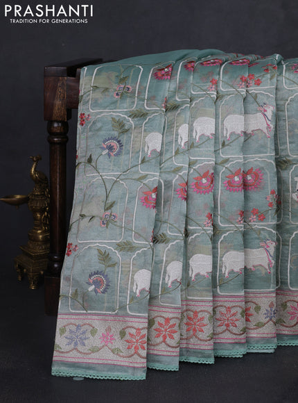 Tissue silk saree pastel green with allover pichwai embroidery work and embroidery border