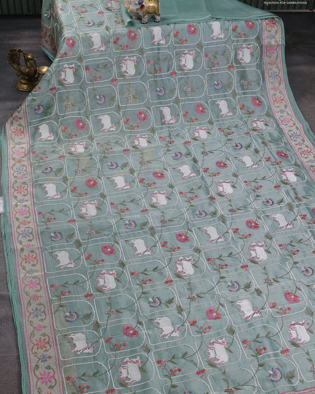 Tissue silk saree pastel green with allover pichwai embroidery work and embroidery border