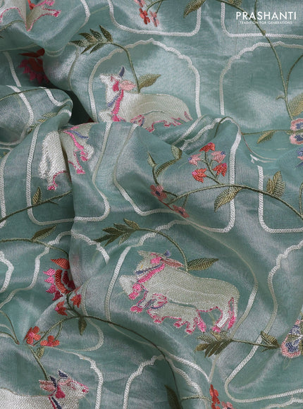 Tissue silk saree pastel green with allover pichwai embroidery work and embroidery border