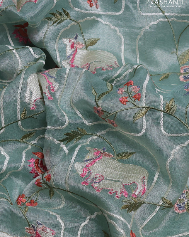 Tissue silk saree pastel green with allover pichwai embroidery work and embroidery border