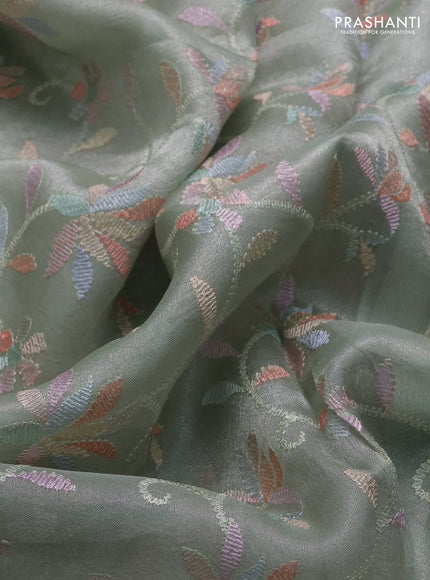 Tissue silk saree pastel green with allover embroidery work