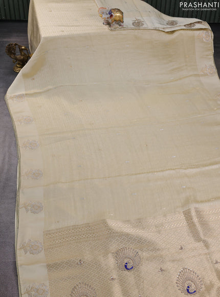 Banarasi silk saree cream with allover zari woven brocade weaves and embroidery pallu & zari woven butta border