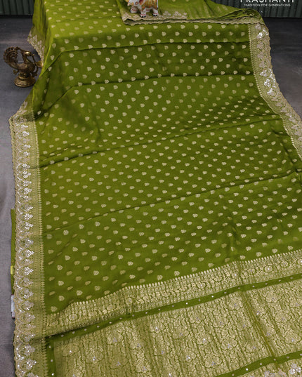 Banarasi silk saree mehendi green with allover zari woven buttas and mirror work embroidery border
