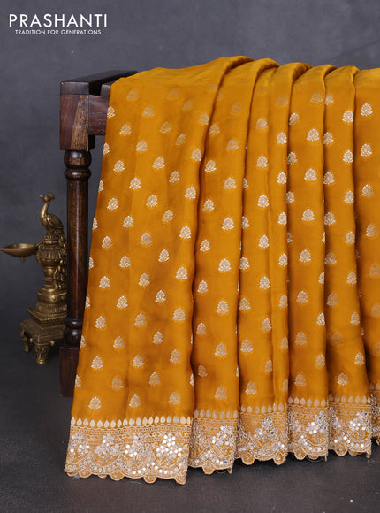 Banarasi silk saree dark mustard with allover zari woven buttas and mirror work embroidery border