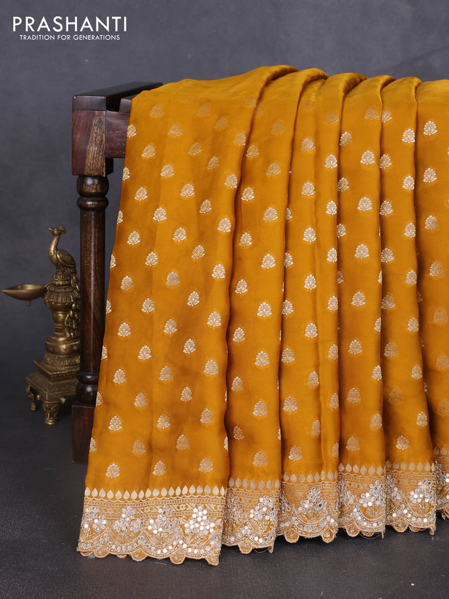 Banarasi silk saree dark mustard with allover zari woven buttas and mirror work embroidery border