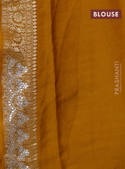 Banarasi silk saree dark mustard with allover zari woven buttas and mirror work embroidery border
