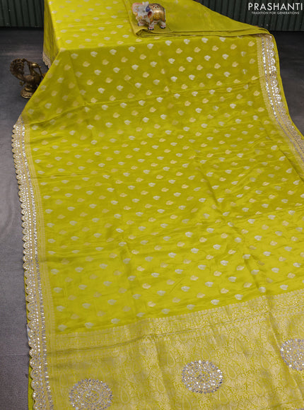 Banarasi silk saree lime green with allover silver & gold zari woven buttas and mirror work embroidery border