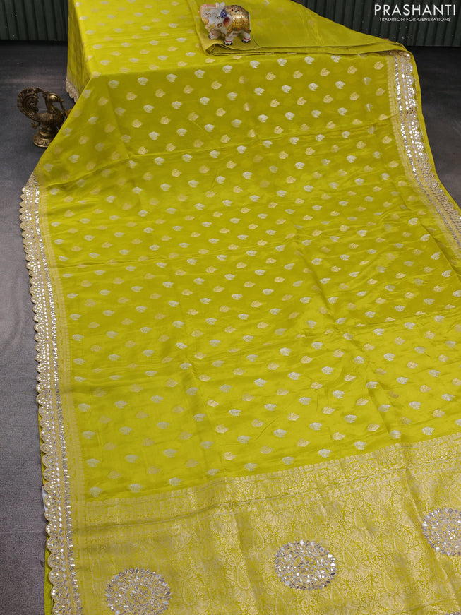 Banarasi silk saree lime green with allover silver & gold zari woven buttas and mirror work embroidery border