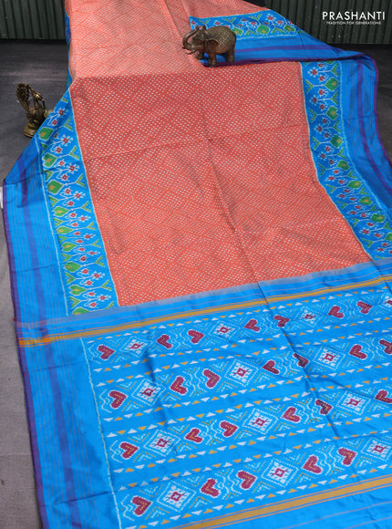 Pochampally silk saree rustic orange and cs blue with allover ikat butta weaves and long ikat woven simple border