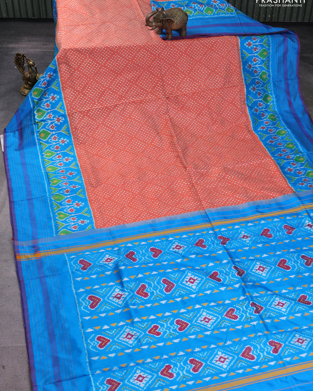 Pochampally silk saree rustic orange and cs blue with allover ikat butta weaves and long ikat woven simple border