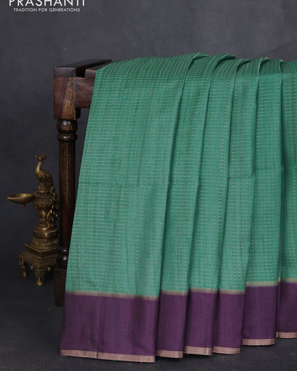 Semi tussar saree teal green and deep purple with allover zari weaves and rettapet zari woven border