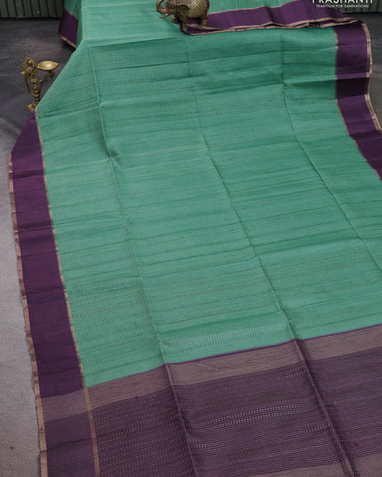 Semi tussar saree teal green and deep purple with allover zari weaves and rettapet zari woven border