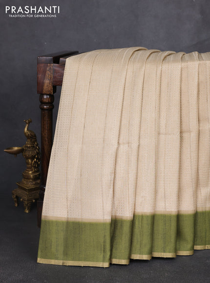 Semi tussar saree beige and light green with allover zari weaves and rettapet zari woven border