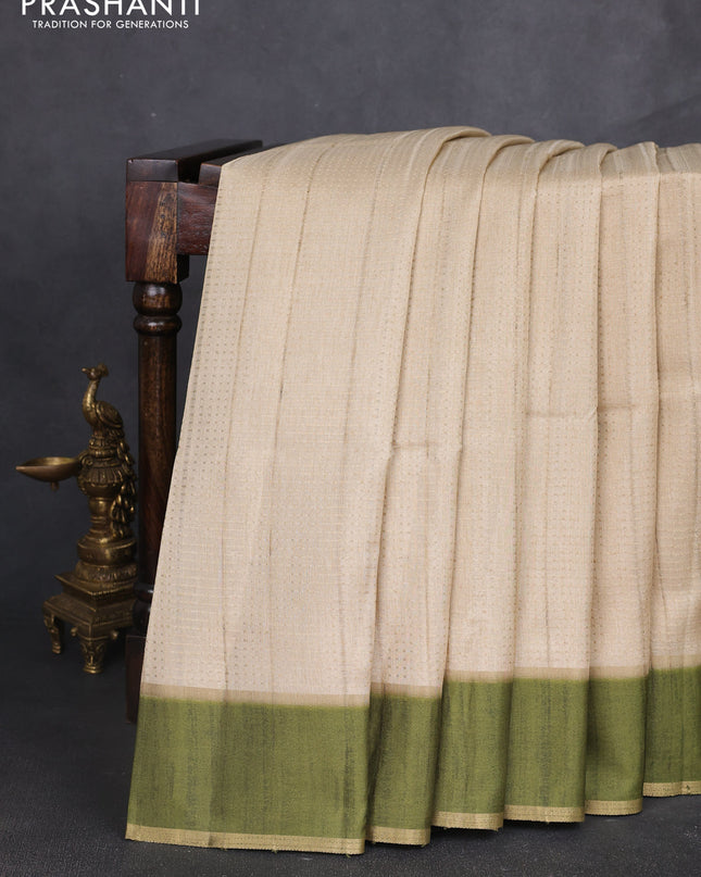 Semi tussar saree beige and light green with allover zari weaves and rettapet zari woven border
