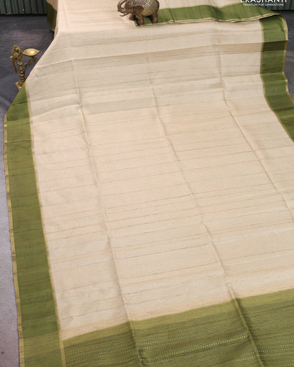 Semi tussar saree beige and light green with allover zari weaves and rettapet zari woven border
