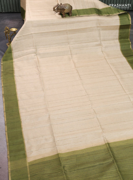 Semi tussar saree beige and light green with allover zari weaves and rettapet zari woven border