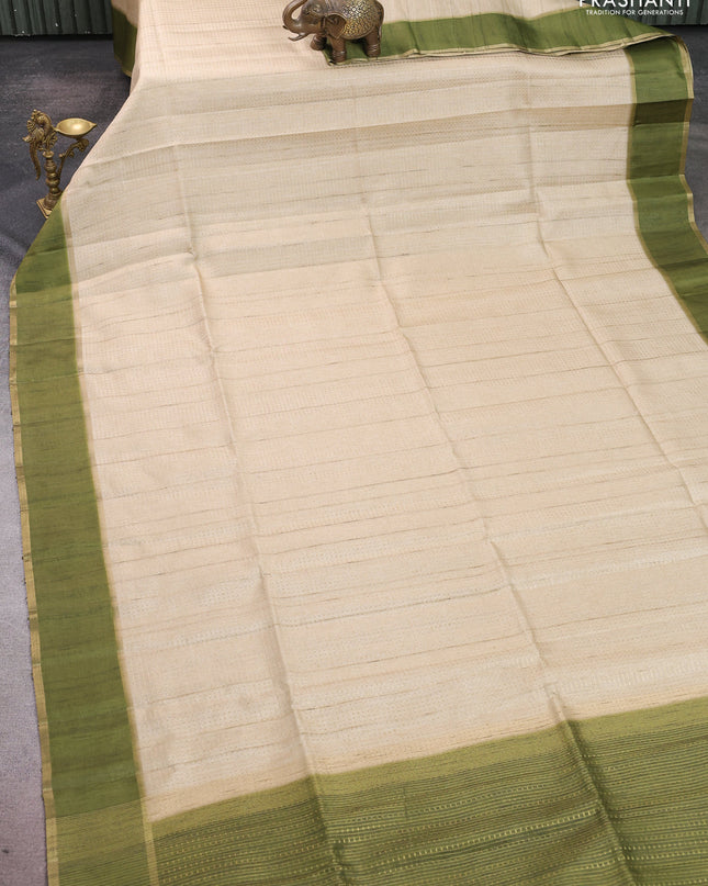 Semi tussar saree beige and light green with allover zari weaves and rettapet zari woven border