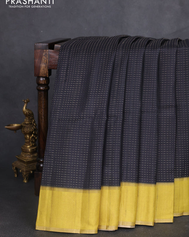 Semi tussar saree black and lime yellow with allover zari weaves and rettapet zari woven border