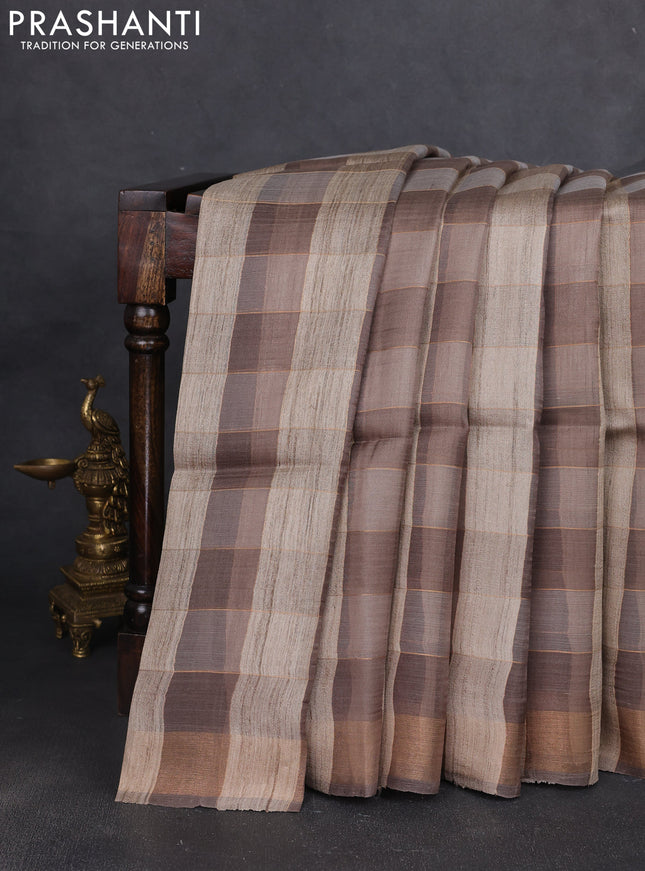Pure dupion silk saree beige grey and grey with allover zari woven checked pattern and concept printed pallu