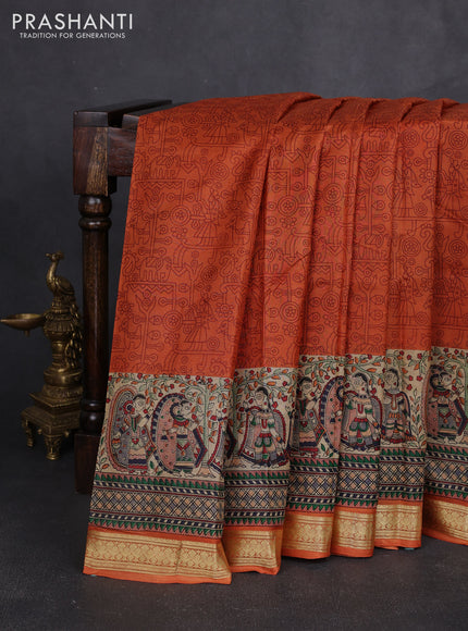 Pure printed silk saree orange with allover prints and madhubani printed zari woven border