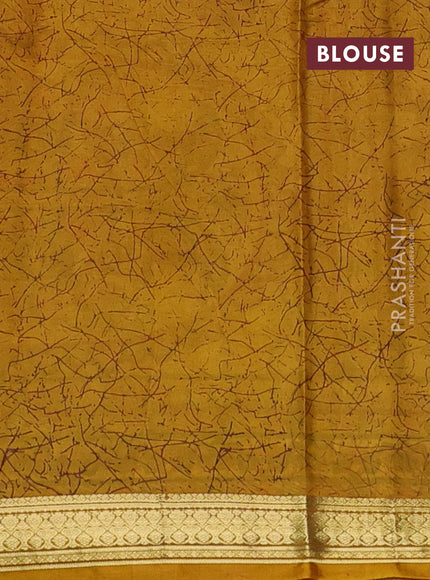 Pure printed silk saree mustard yellow with allover prints and madhubani printed zari woven border