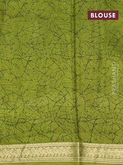 Pure printed silk saree light green with allover prints and madhubani printed zari woven border
