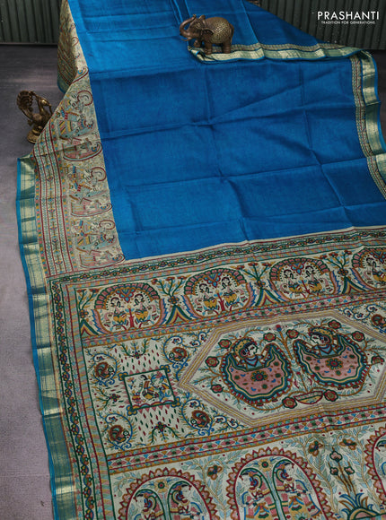 Pure printed silk saree cs blue with allover prints and madhubani printed zari woven border