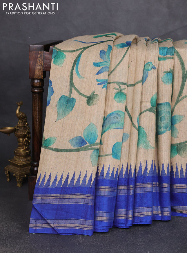 Pure tussar silk saree beige and royal blue with allover kalamkari hand painted prints and temple design rettatpet zari woven border