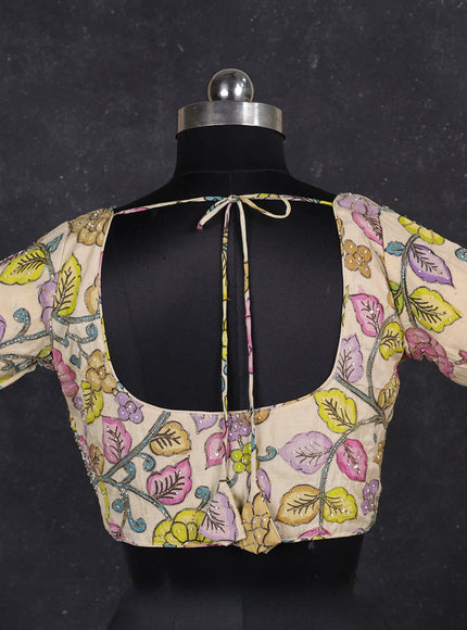 Silk penkalamkari readymade blouse cream with allover kalamkari prints & pita work and back knot