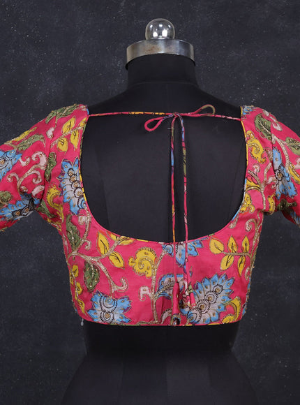 Silk penkalamkari readymade blouse pink with allover kalamkari prints & pita work and back knot