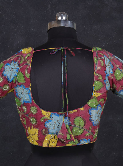 Silk penkalamkari readymade blouse wine shade with allover kalamkari prints & pita work and back knot