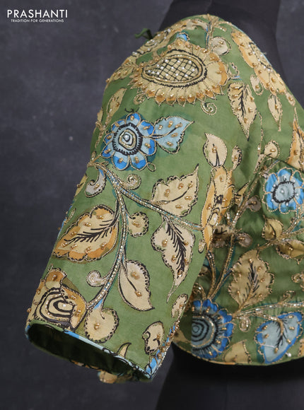 Silk penkalamkari readymade blouse green with allover kalamkari prints & pita work and back knot