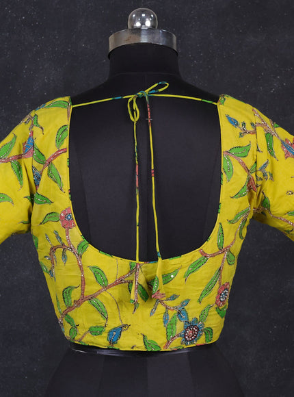 Silk penkalamkari readymade blouse lime yellow with allover kalamkari prints & pita work and back knot