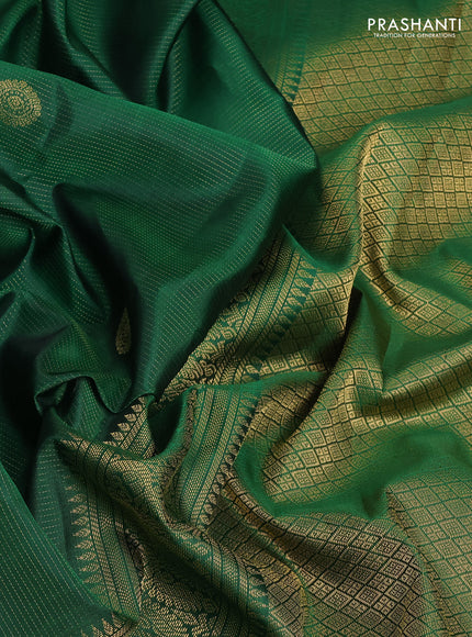 Pure kanchipuram silk saree green with allover zari weaves & buttas and zari woven border