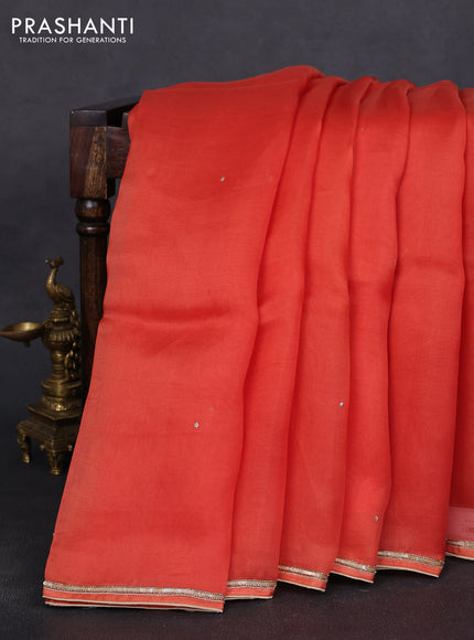 Pure organza silk saree orange with embroidery zari buttas and sequin embroidered border