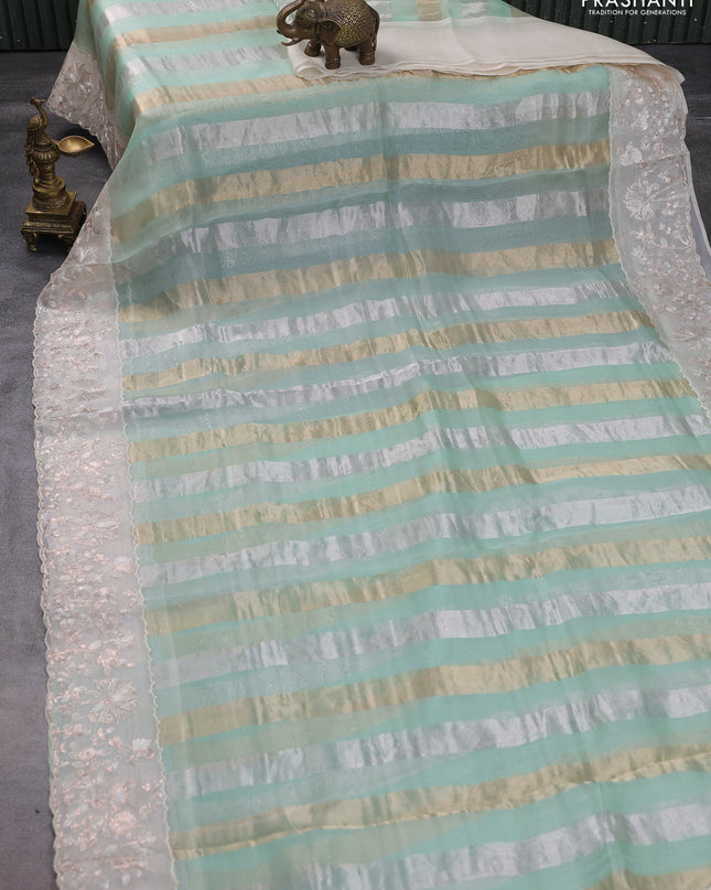 Pure organza silk saree pastel green and cream with allover silver & gold stripes pattern and embroidery border