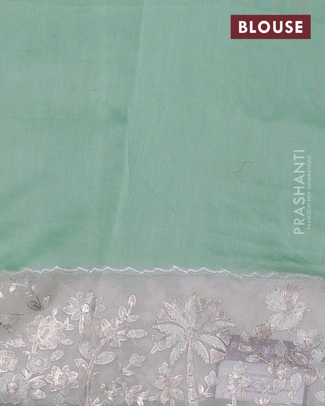 Pure organza silk saree pastel green and cream with allover silver & gold stripes pattern and embroidery border