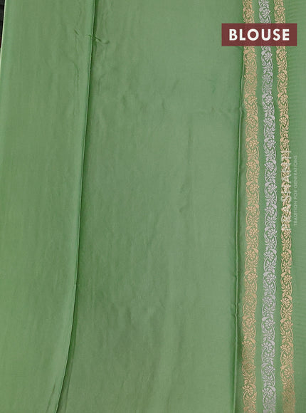 Banarasi mushru silk saree pastel green with allover stripes pattern & zari buttas and satin border