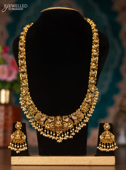 Antique haram lakshmi design with pink kemp & cz stones and pearl hangings