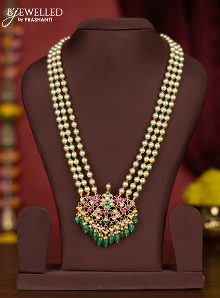 jadau pearl haaram with jadau kundan floral pendant  and green beads hanging