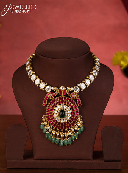Jadau necklace double peacock pendant with jadau kundan stones and green beads hanging
