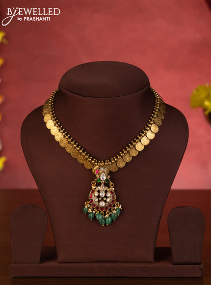 Jadau necklace lakshmi kasu design with jadau kundan stones mint green beads