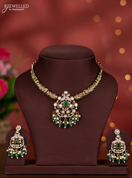 Necklace with emerald & kundan cz stones and green beads hangings in victorian finish