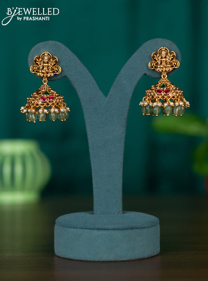 Antqiue jhumka with lakshmi design in jadau stones and green beads hanging