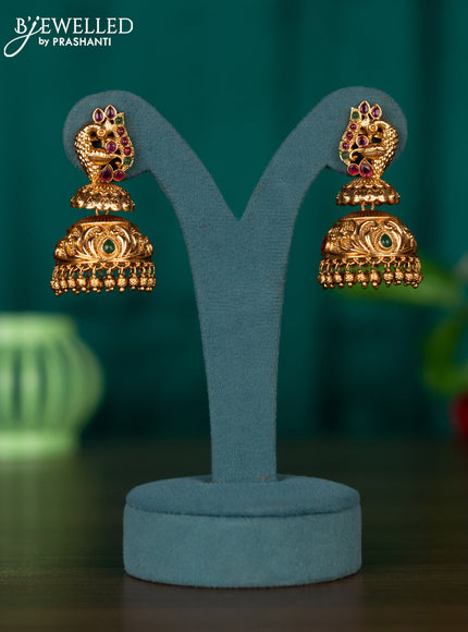 Antqiue jhumka with peacock design in kemp stones and golden beads hanging