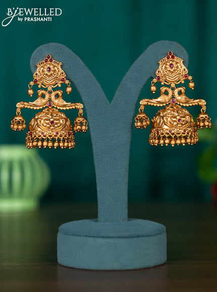 Antqiue jhumka with double peacock design in kemp stones and golden beads hanging